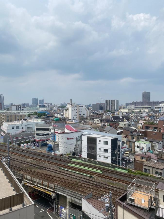 台東区寝室4つと広々吹き抜けリビングのメゾネットタイプのお家 Tokyo